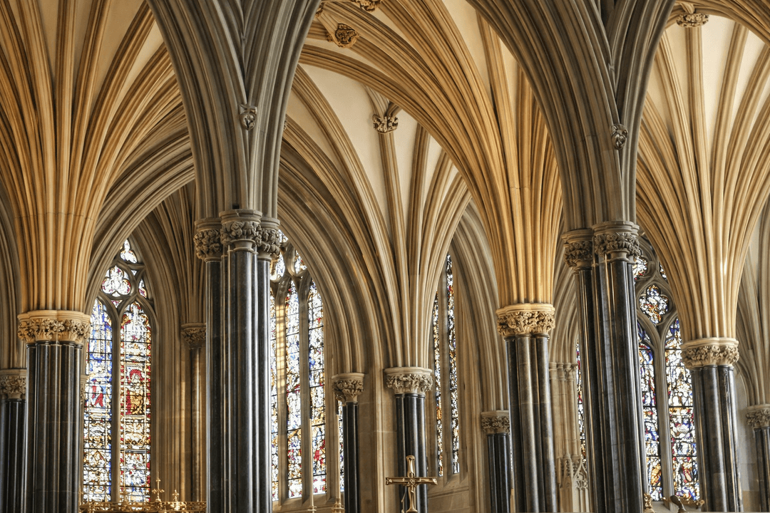 Gothic cathedral vaulting above stained glass windows